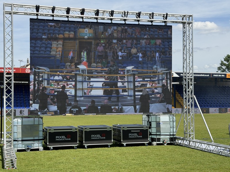 Outdoor LED screen on a truss goalpost at a football stadium