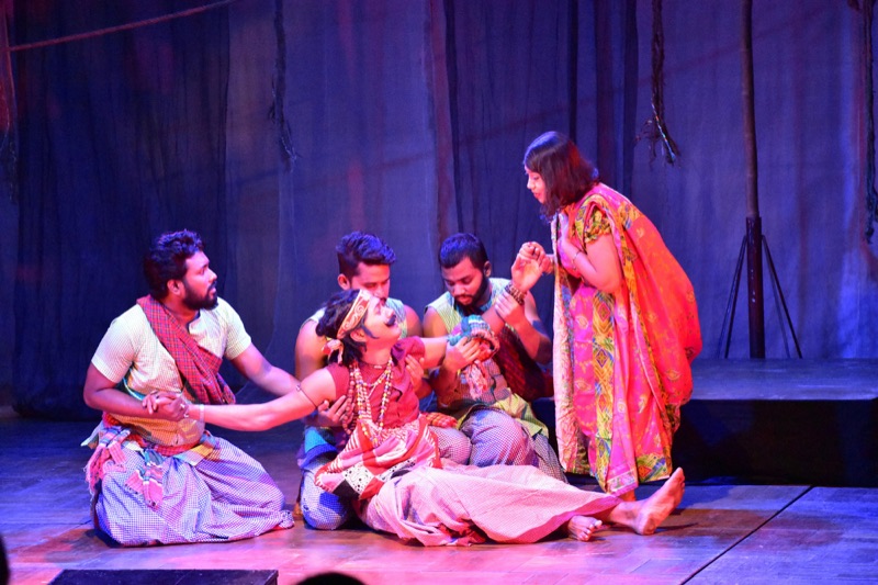 Actors performing a dramatic scene on a studio stage